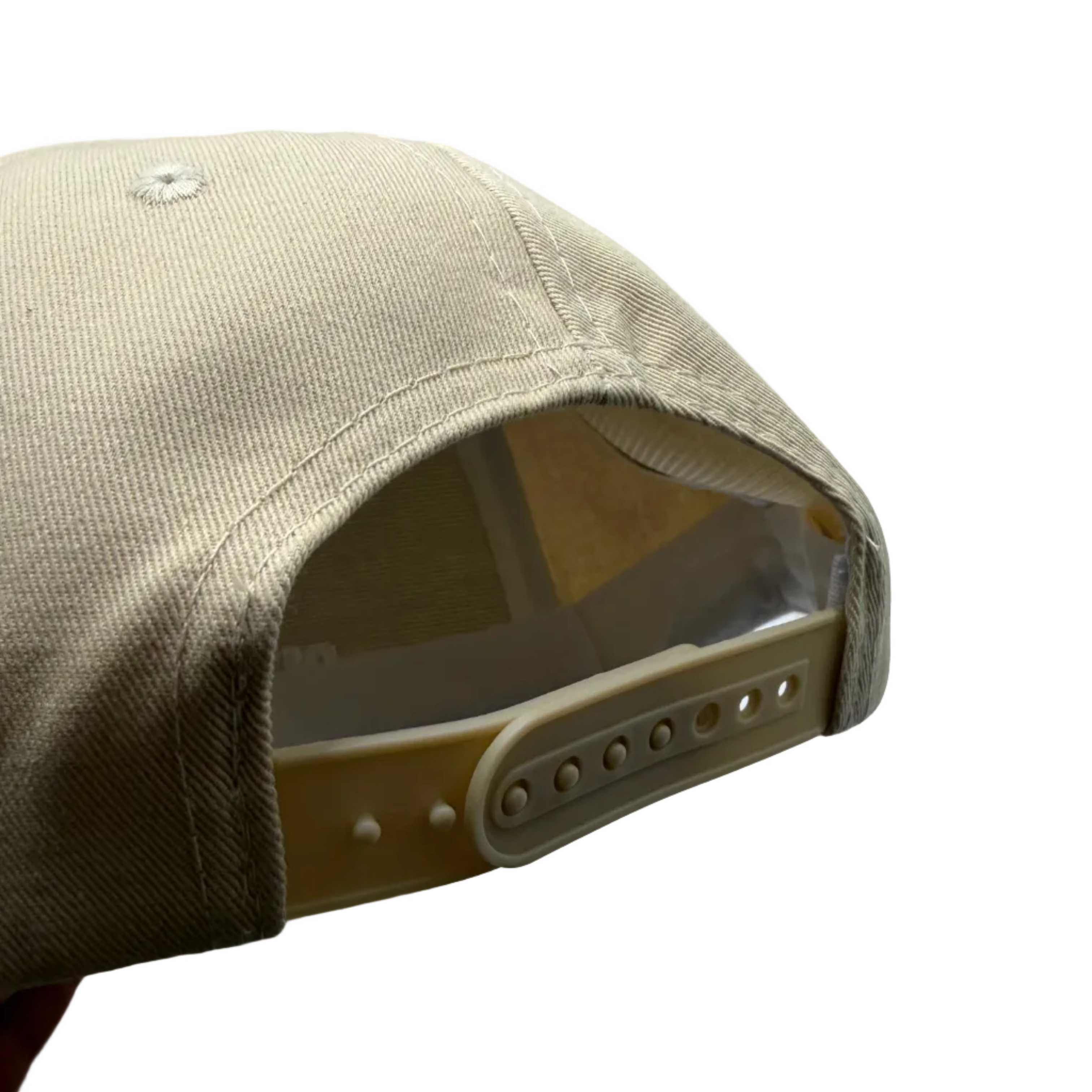 Beige cap with a clear visor on a light gray background